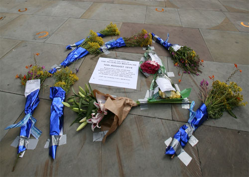 commemorative flowers and 'plaque'